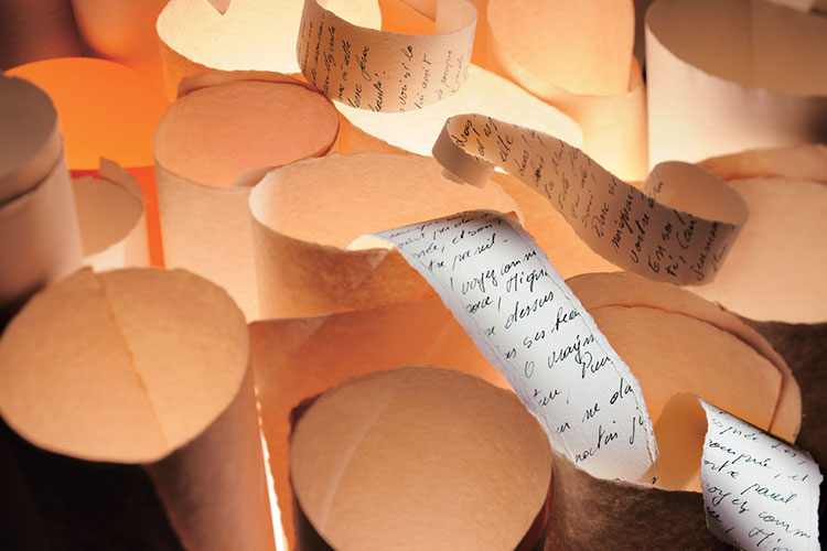 Rolls of scroll-like paper with handwriting
