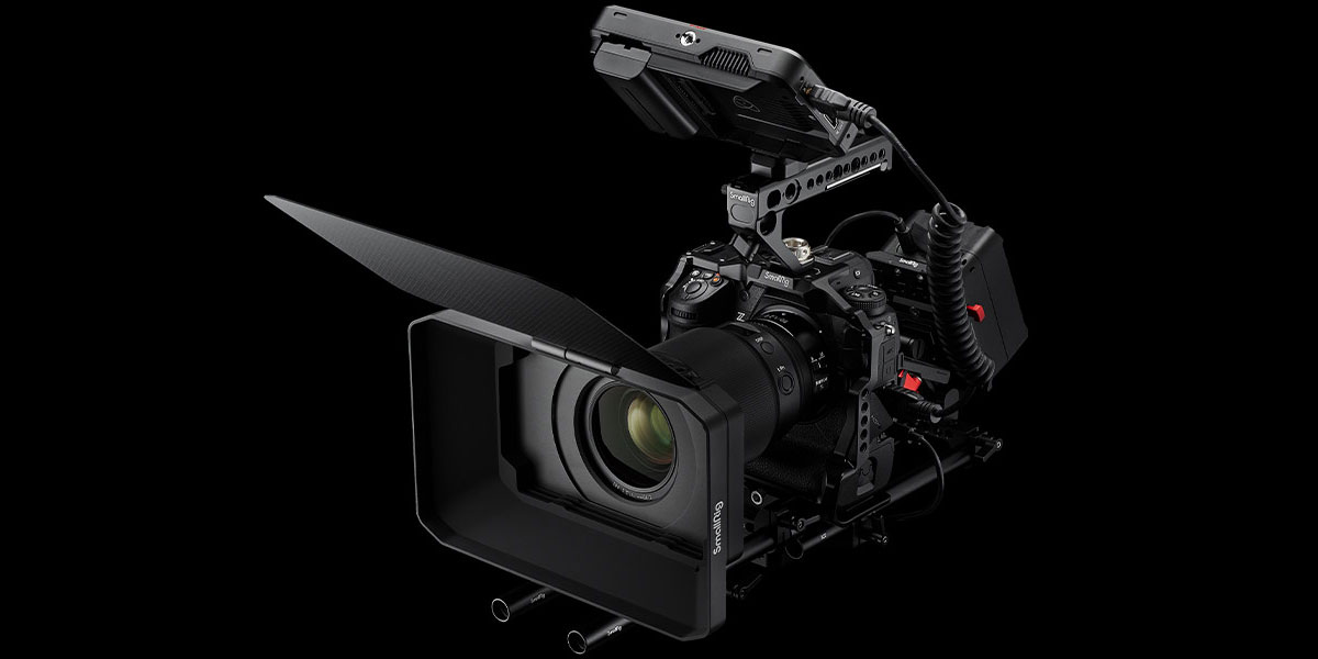 Product photo of the Z 9 mirrorless camera in a rig with video accessories including a loupe and external LCD