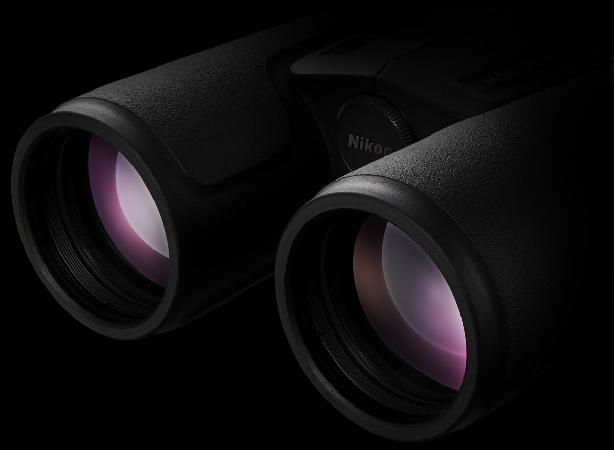 Close up of the front objective lenses of a pair of Monarch M5 binoculars