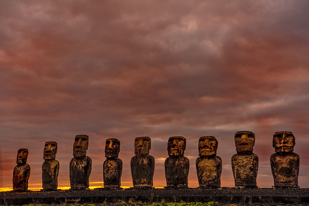 Digital art of a moai statue against a dramatic background